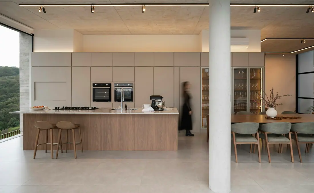 Bright open-plan kitchen and dining area with large windows